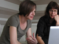 A lecturer giving feedback to Claire Salter